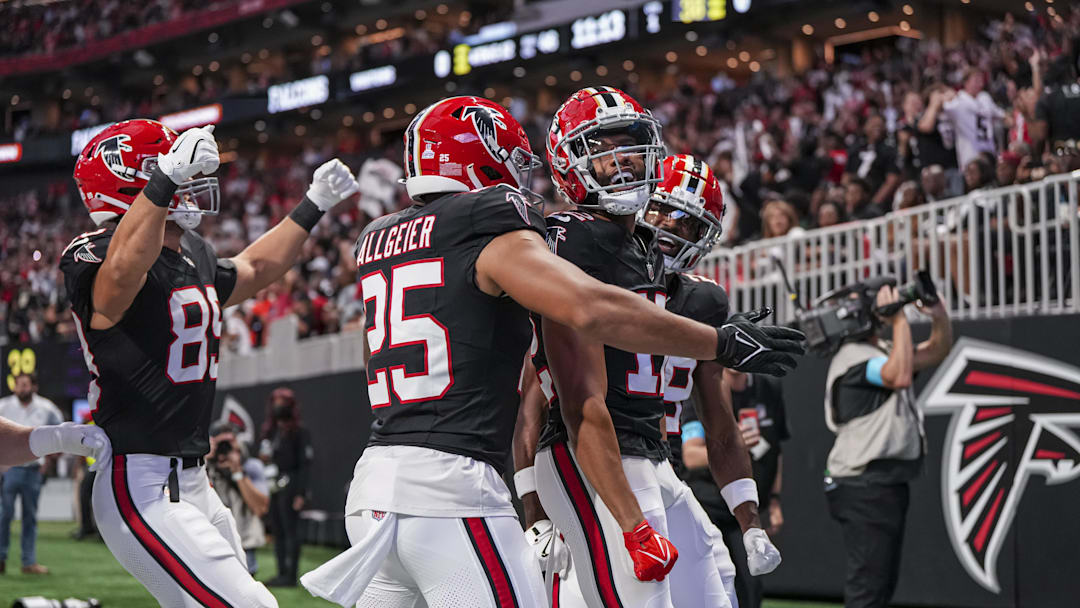 Sep 29, 2024; Atlanta, Georgia, USA; Atlanta Falcons wide receiver KhaDarel Hodge (12) reacts after recovering a muffed punt for a touchdown against the New Orleans Saints during the first quarter at Mercedes-Benz Stadium. Mandatory Credit: Dale Zanine-Imagn Images