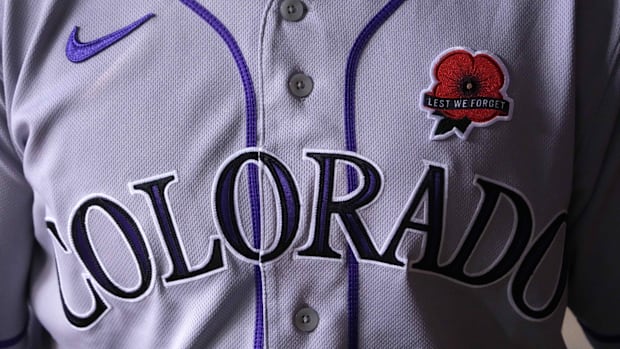 A white jersey with Colorado written in dark purple.