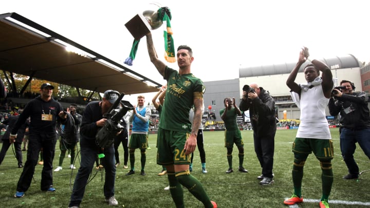 Oct 22, 2017; Portland, OR, USA; Portland Timbers defender Liam Ridgewell (24) raises the Cascadia Cup after Timbers defeated Vancouver Whitecaps 2-1 at Providence Park. Mandatory Credit: Jaime Valdez-USA TODAY Sports