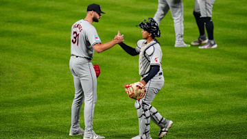 May 28, 2024; Denver, Colorado, USA; Cleveland Guardians pitcher Sam Hentges (31) and catcher Bo Naylor (23) celebrate defeating the Colorado Rockies at Coors Field. Mandatory Credit: Ron Chenoy-Imagn Images