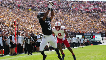 Sep 9, 2023; Boulder, Colorado, USA; Colorado Buffaloes running back Dylan Edwards (3) reaches for the ball past Nebraska Cornhuskers cornerback Deshon Singleton (8) in the third quarter at Folsom Field. Mandatory Credit: Ron Chenoy-USA TODAY Sports
