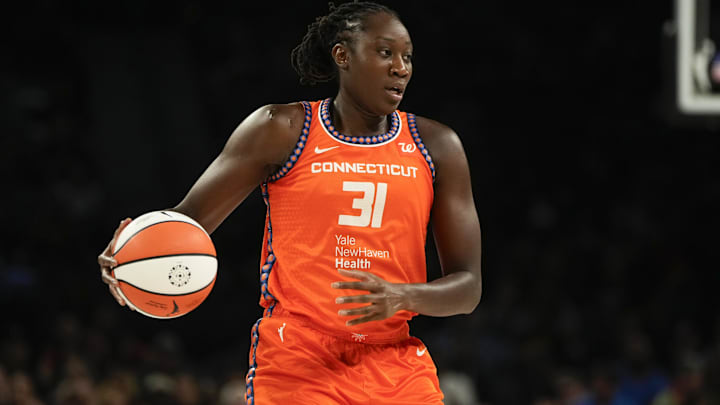 Aug 10, 2025; Las Vegas, Nevada, USA; Connecticut Sun center Tina Charles (31) dribbles the ball against the Las Vegas Aces during the first half of a WNBA basketball game at Michelob Ultra Arena.  Lucas Peltier-Imagn Images
