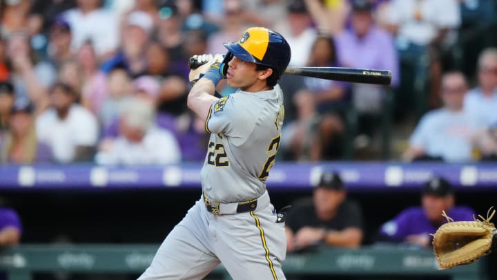 Jul 2, 2024; Denver, Colorado, USA; Milwaukee Brewers outfielder Christian Yelich (22) doubles in the third inning against the Colorado Rockies at Coors Field. Mandatory Credit: Ron Chenoy-USA TODAY Sports