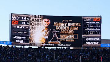 Nov 29, 2024; Boulder, Colorado, USA; Colorado Buffaloes quarterback Shedeur Sanders (2) is announced to win the Johnny Unitas Golden arm award during the game Oklahoma State Cowboys at Folsom Field. Mandatory Credit: Ron Chenoy-Imagn Images