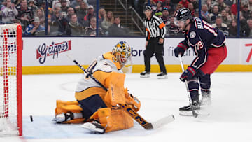 Blue Jackets center Adam Fantilli scores on Predators goaltender Juuse Saros. 