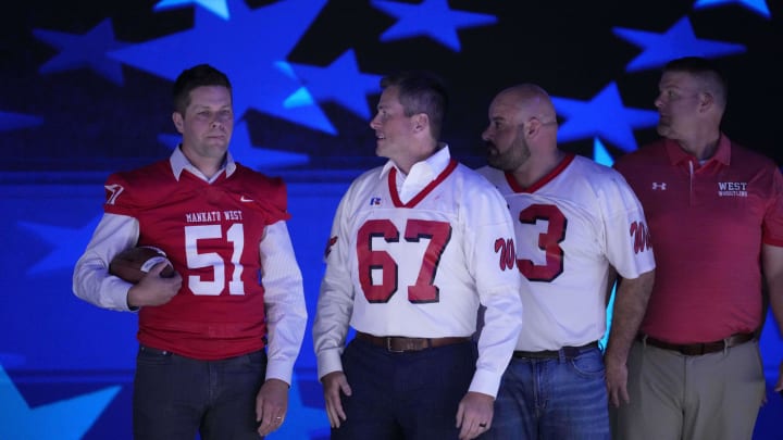 Members of the Mankato West football team coached by Tim Walz appear on stage Wednesday during the DNC at the United Center.