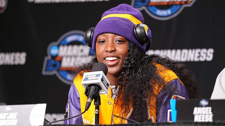 LSU Lady Tigers guard Flau'jae Johnson (4) takes questions from the media at MVP Arena.