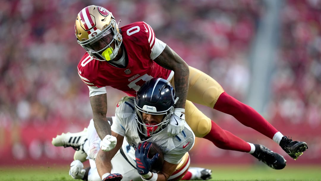 Dec 14, 2025; Santa Clara, California, USA;  San Francisco 49ers cornerback Renardo Green (0) tackles Tennessee Titans wide receiver Chimere Dike (17) during the fourth quarter at Levi's Stadium. Mandatory Credit: Cary Edmondson-Imagn Images