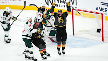 Jan 12, 2025; Las Vegas, Nevada, USA; Vegas Golden Knights left wing Pavel Dorofeyev (16) and Vegas Golden Knights right wing Victor Olofsson (95) celebrate after Vegas Golden Knights center Tomas Hertl (48) scored a goal against the Minnesota Wild during the third period at T-Mobile Arena. Mandatory Credit: Stephen R. Sylvanie-Imagn Images