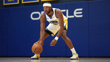 Sep 29, 2025; San Francisco, CA, USA; Golden State Warriors guard Moses Moody (4) dribbles the ball during Media Day at the Chase Center.