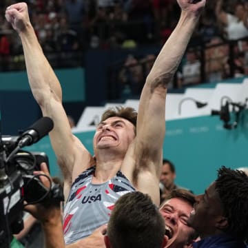 Stephen Nedoroscik reacts with teammates after he performs on the pommel horse during the men’s team final during the 2024 Paris Olympics.