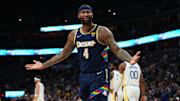 Denver Nuggets center DeMarcus Cousins reacts to a foul in the second quarter against the Golden State Warriors of the first round for the 2022 NBA playoffs at Ball Arena. 