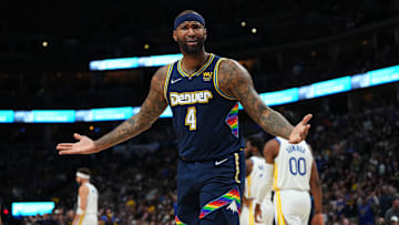 Denver Nuggets center DeMarcus Cousins reacts to a foul in the second quarter against the Golden State Warriors of the first round for the 2022 NBA playoffs at Ball Arena. 