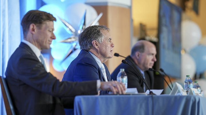 North Carolina Tar Heels chancellor Lee Roberts, new head coach Bill Belichick and athletic director Bubba Cunningham 