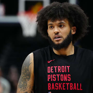 Jan 7, 2024; Denver, Colorado, USA; Detroit Pistons forward Isaiah Livers (12) before the game against the Denver Nuggets at Ball Arena. Mandatory Credit: Ron Chenoy-Imagn Images