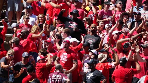 Nebraska Cornhuskers fans celebrate a score in the third quarter against the Colorado Buffaloes