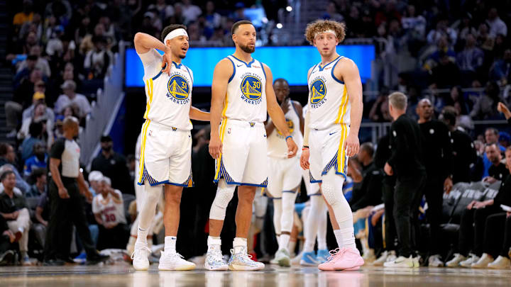 Apr 5, 2026; San Francisco, California, USA; Golden State Warriors guard Seth Curry (31), guard Stephen Curry (30) and guard Brandin Podziemski (2) stand on the court during a timeout against the Houston Rockets in the second quarter at the Chase Center. Mandatory Credit: Cary Edmondson-Imagn Images