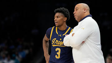 Mar 12, 2025; Charlotte, NC, USA; Notre Dame Fighting Irish guard Markus Burton (3) with head coach Micah Shrewsberry in the first half at Spectrum Center. Mandatory Credit: Bob Donnan-Imagn Images