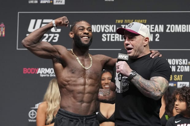 Aljamain Sterling talks with Joe Rogan during weigh-ins for UFC 273 at VyStar Veterans Memorial Stadium. 