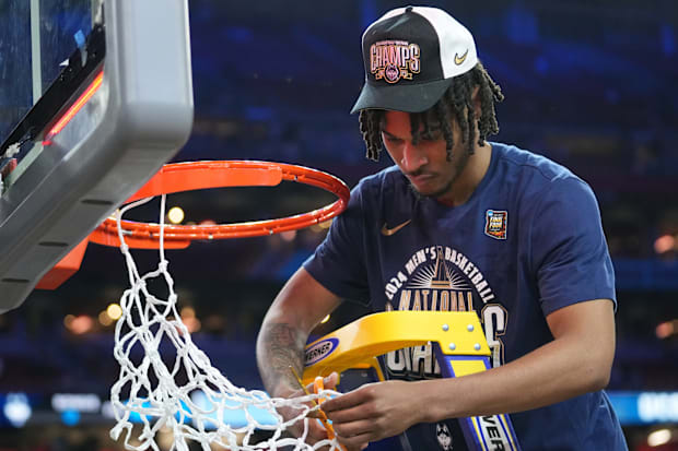 Connecticut Huskies guard Stephon Castle (5) cuts the basketball net after winning the Men's NCAA national championship game.