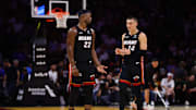 Oct 30, 2024; Miami, Florida, USA; Miami Heat forward Jimmy Butler (22) and guard Tyler Herro (14) talk on the court against the New York Knicks during the second quarter at Kaseya Center. Mandatory Credit: Sam Navarro-Imagn Images