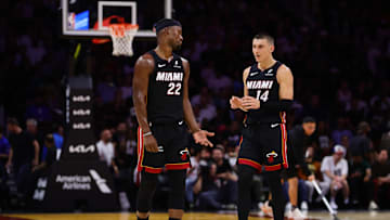 Oct 30, 2024; Miami, Florida, USA; Miami Heat forward Jimmy Butler (22) and guard Tyler Herro (14) talk on the court against the New York Knicks during the second quarter at Kaseya Center. Mandatory Credit: Sam Navarro-Imagn Images