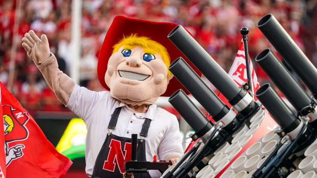 Herbie Husker waves to fans at the start of the second quarter between the Nebraska Cornhuskers and Northern Illinois.