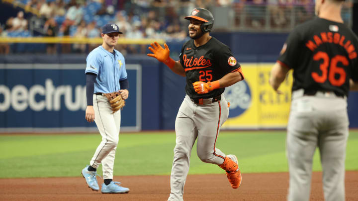 Aug 11, 2024; St. Petersburg, Florida, USA;  Baltimore Orioles outfielder Anthony Santander (25) smiles as he runs around the bases after he hit a home run during the fourth inning against the Tampa Bay Rays at Tropicana Field.