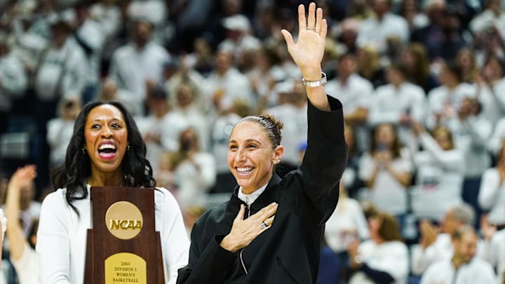 Jan 27, 2024; Storrs, Connecticut, USA; WNBA player and former UConn Huskies player Diana Taurasi waves to the crowd as she and other players are recognized for their championship wins at UConn before the start of the game against the Notre Dame Fighting Irish at Harry A. Gampel Pavilion. Mandatory Credit: David Butler II-Imagn Images