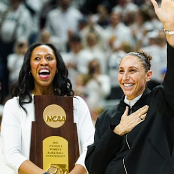 Jan 27, 2024; Storrs, Connecticut, USA; WNBA player and former UConn Huskies player Diana Taurasi waves to the crowd as she and other players are recognized for their championship wins at UConn before the start of the game against the Notre Dame Fighting Irish at Harry A. Gampel Pavilion. Mandatory Credit: David Butler II-Imagn Images