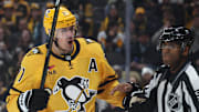 Nov 22, 2025; Pittsburgh, Pennsylvania, USA;  Pittsburgh Penguins center Evgeni Malkin (71) reacts to the Seattle Kraken as linesman Shandor Alphonso (52) restrains Malkin during the third period at PPG Paints Arena. Mandatory Credit: Charles LeClaire-Imagn Images