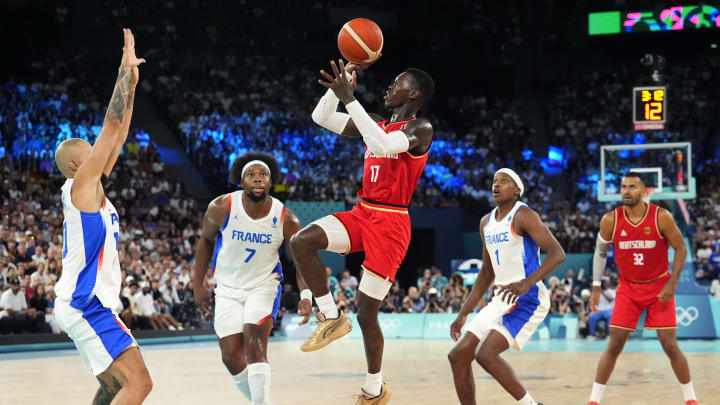 Aug 8, 2024; Paris, France; Germany point guard Dennis Schroder (17) shoots the ball during the second half against France in a men's basketball semifinal game during the Paris 2024 Olympic Summer Games at Accor Arena. Mandatory Credit: Rob Schumacher-USA TODAY Sports