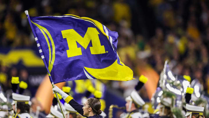 Jan 8, 2024; Houston, TX, USA; A Michigan Wolverines marching band color guard flag member carries the Michigan flag across the field before the Wolverines played against the Washington Huskies in the 2024 College Football Playoff national championship game at NRG Stadium. Mandatory Credit: Thomas Shea-USA TODAY Sports