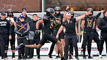 Nov 22, 2025; Chicago, Illinois, USA; Northwestern Wildcats wide receiver Hayden Eligon II (80) runs the ball against the Minnesota Golden Gophers during the second half at Wrigley Field. Mandatory Credit: Patrick Gorski-Imagn Images