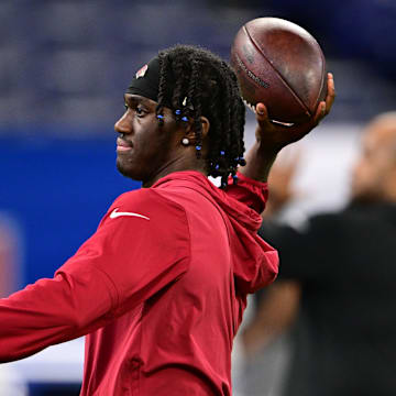 Aug 17, 2024; Indianapolis, Indiana, USA; Arizona Cardinals wide receiver Marvin Harrison Jr. (18) throws a ball during warm ups before the game against the Indianapolis Colts at Lucas Oil Stadium. Mandatory Credit: Marc Lebryk-Imagn Images