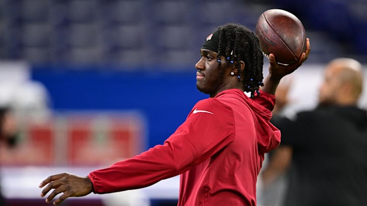 Aug 17, 2024; Indianapolis, Indiana, USA; Arizona Cardinals wide receiver Marvin Harrison Jr. (18) throws a ball during warm ups before the game against the Indianapolis Colts at Lucas Oil Stadium. Mandatory Credit: Marc Lebryk-Imagn Images