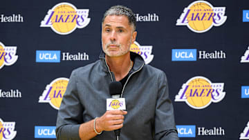 Sep 25, 2025; El Segundo, CA, USA; Los Angeles Lakers general manager Rob Pelinka, left, speaks during a press conference to preview the 2025-26 season at UCLA Health Training Center. Mandatory Credit: William Liang-Imagn Images