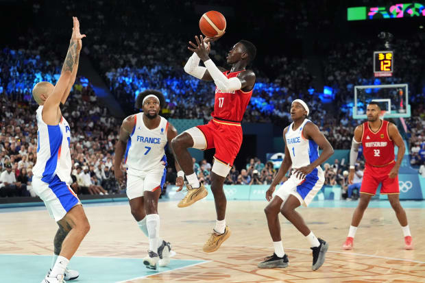 Germany point guard Dennis Schroder shoots the ball during the second half against France in a men's basketball semifinal.