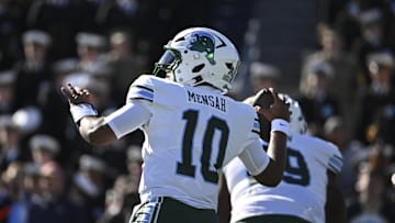 Nov 16, 2024; Annapolis, Maryland, USA; Tulane Green Wave quarterback Darian Mensah (10) drops back to pass during the first quarter against the Navy Midshipmen   at Navy-Marine Corps Memorial Stadium. Mandatory Credit: Tommy Gilligan-Imagn Images