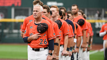 Jun 16, 2023; Omaha, NE, USA;  Virginia Cavaliers head coach Brian O'Connor stands for the national anthem before the game against the Florida Gators at Charles Schwab Field Omaha. Mandatory Credit: Steven Branscombe-Imagn Images