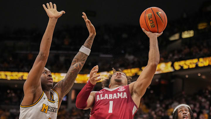 Feb 19, 2025; Columbia, Missouri, USA; Alabama Crimson Tide guard Mark Sears (1) shoots as Missouri Tigers guard Marcus Allen (4) defends during the second half at Mizzou Arena. Mandatory Credit: Denny Medley-Imagn Images