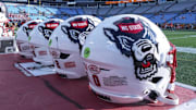 Sep 7, 2024; Charlotte, North Carolina, USA; North Carolina State Wolfpack helmets during pregame activity for the Dukes Mayo Classic against the Tennessee Volunteers at Bank of America Stadium. Mandatory Credit: Jim Dedmon-Imagn Images