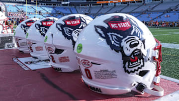 Sep 7, 2024; Charlotte, North Carolina, USA; North Carolina State Wolfpack helmets during pregame activity for the Dukes Mayo Classic against the Tennessee Volunteers at Bank of America Stadium. Mandatory Credit: Jim Dedmon-Imagn Images