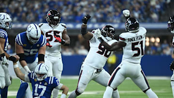 Nov 30, 2025; Indianapolis, Indiana, USA; Houston Texans defensive tackle Sheldon Rankins (90) and Houston Texans defensive end Will Anderson Jr. (51) celebrate after sacking Indianapolis Colts quarterback Daniel Jones (17) during the first half at Lucas Oil Stadium. Mandatory Credit: Robert Goddin-Imagn Images