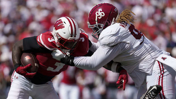 Wisconsin Badgers running back Tawee Walker (3) is tackled by Alabama Crimson Tide defensive lineman Tim Keenan III (96) duri