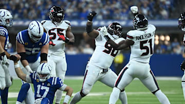 Nov 30, 2025; Indianapolis, Indiana, USA; Houston Texans defensive tackle Sheldon Rankins (90) and Houston Texans defensive end Will Anderson Jr. (51) celebrate after sacking Indianapolis Colts quarterback Daniel Jones (17) during the first half at Lucas Oil Stadium. Mandatory Credit: Robert Goddin-Imagn Images
