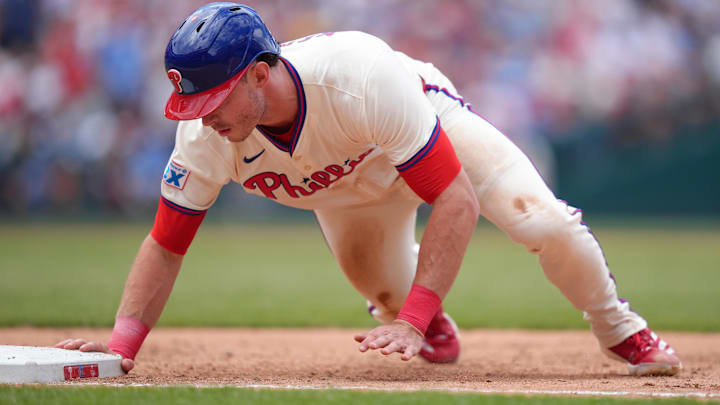 Philadelphia Phillies outfielder Max Kepler (17) dives back to first against the Pittsburgh Pirates in the fifth inning at Citizens Bank Park.