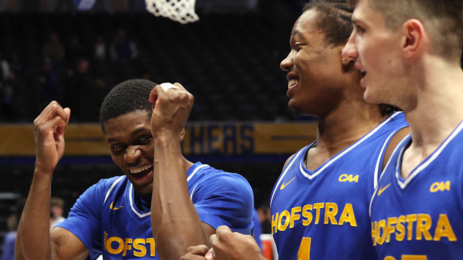 Hofstra Pride players Cruz Davis, Joshua DeCady and German Plotnikov celebrate after defeating the Pittsburgh Panthers.