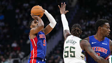 Nov 13, 2024; Milwaukee, Wisconsin, USA;  Detroit Pistons guard Malik Beasley (5) shoots against Milwaukee Bucks guard Delon Wright (55) during the third quarter at Fiserv Forum. Mandatory Credit: Jeff Hanisch-Imagn Images