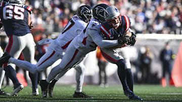 Nov 2, 2025; Foxborough, Massachusetts, USA; Atlanta Falcons defensive tackle Brandon Dorlus (54) sacks New England Patriots quarterback Drake Maye (10) during the first half at Gillette Stadium. Mandatory Credit: Brian Fluharty-Imagn Images